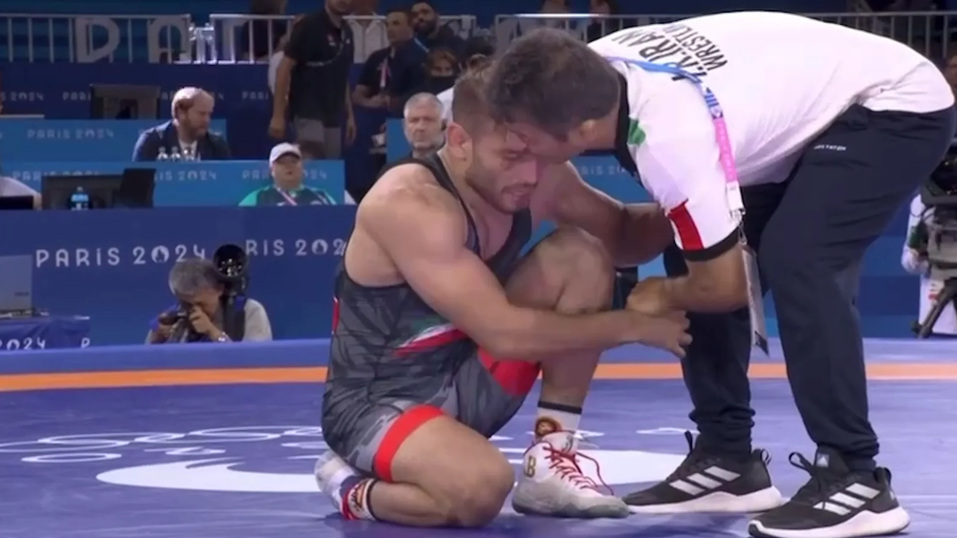 Coach convinces his athlete not to end his career after losing fight at the Olympic Games in wrestling